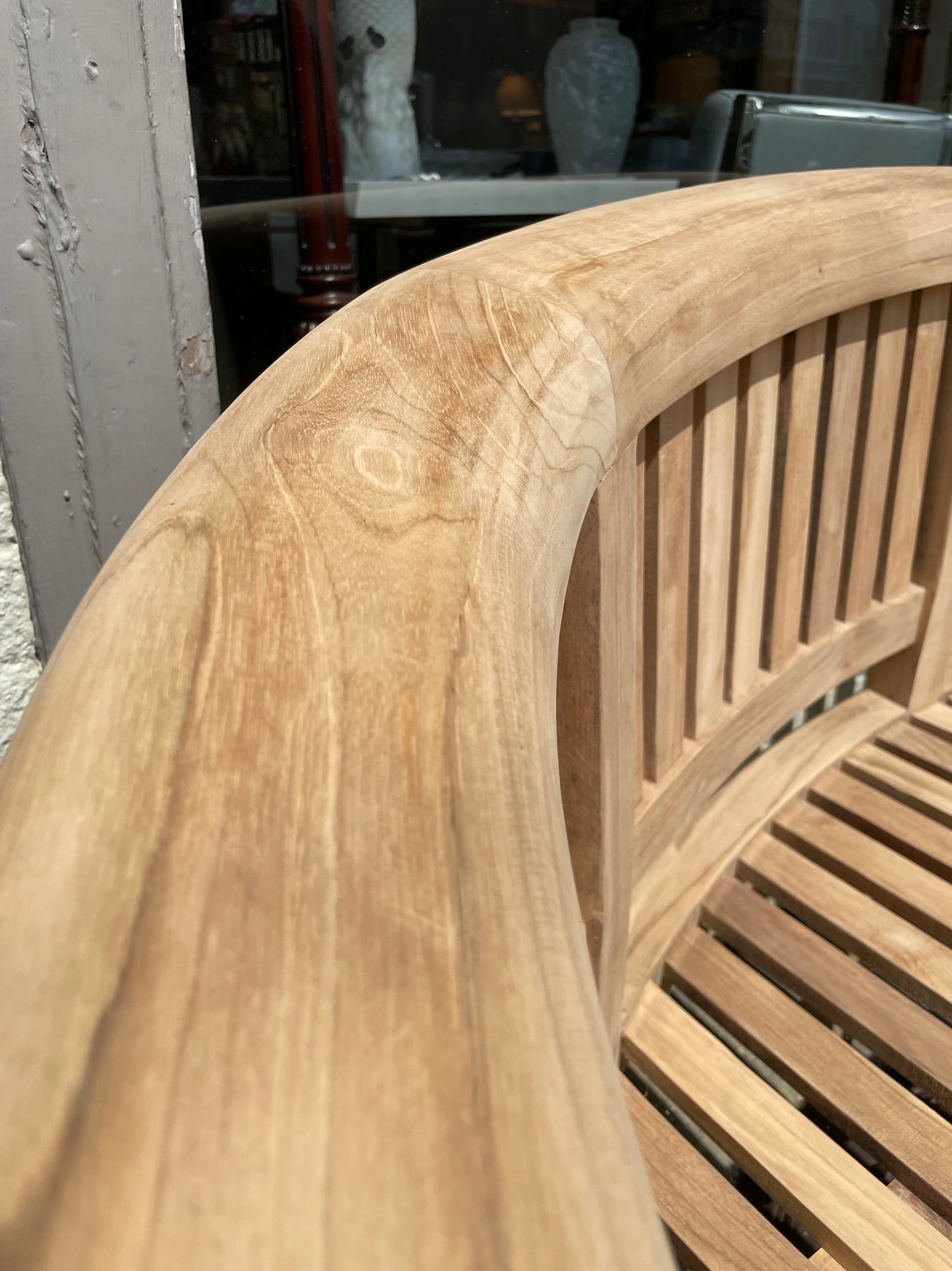 Curved three seater teak bench