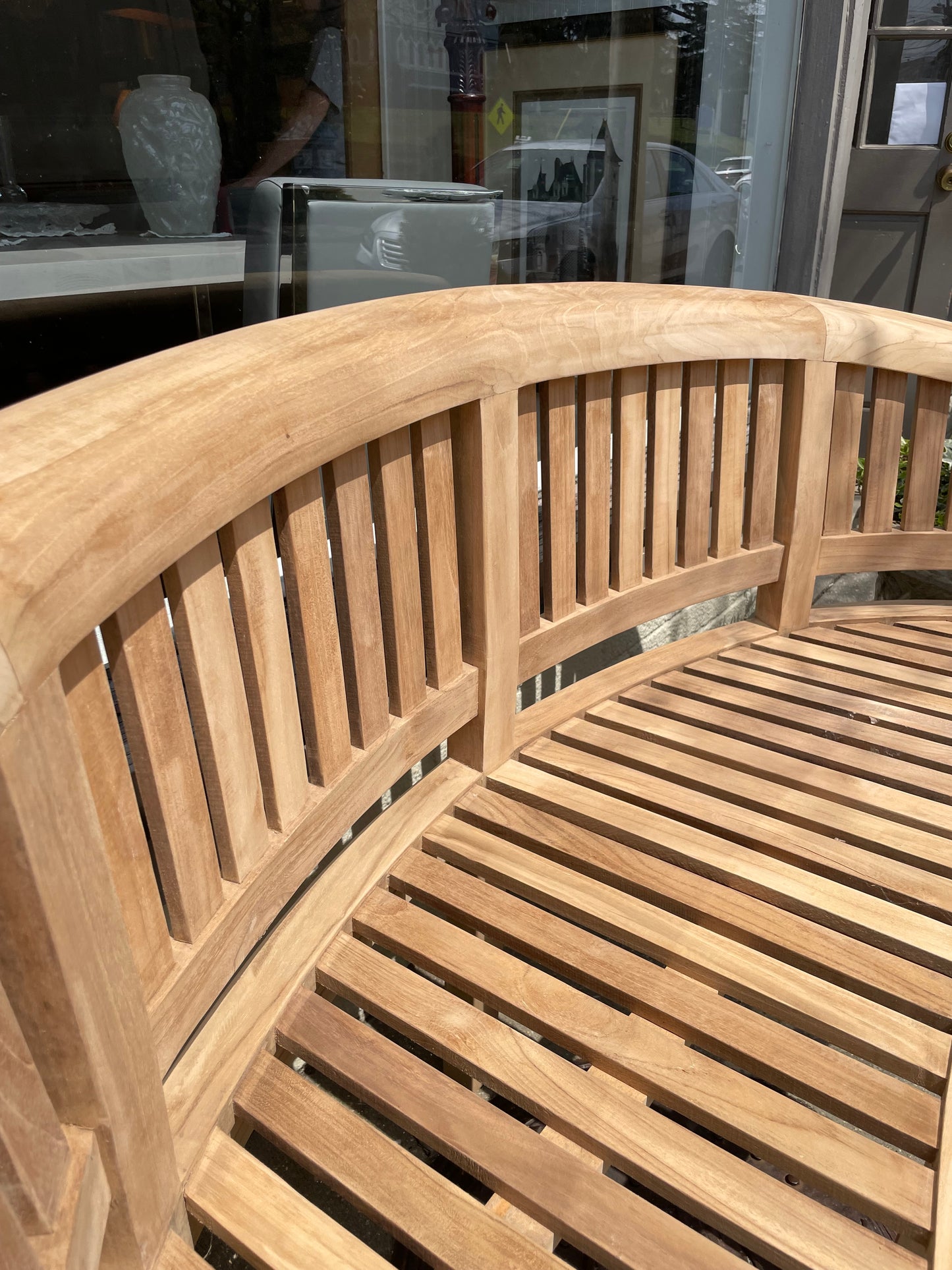Curved three seater teak bench